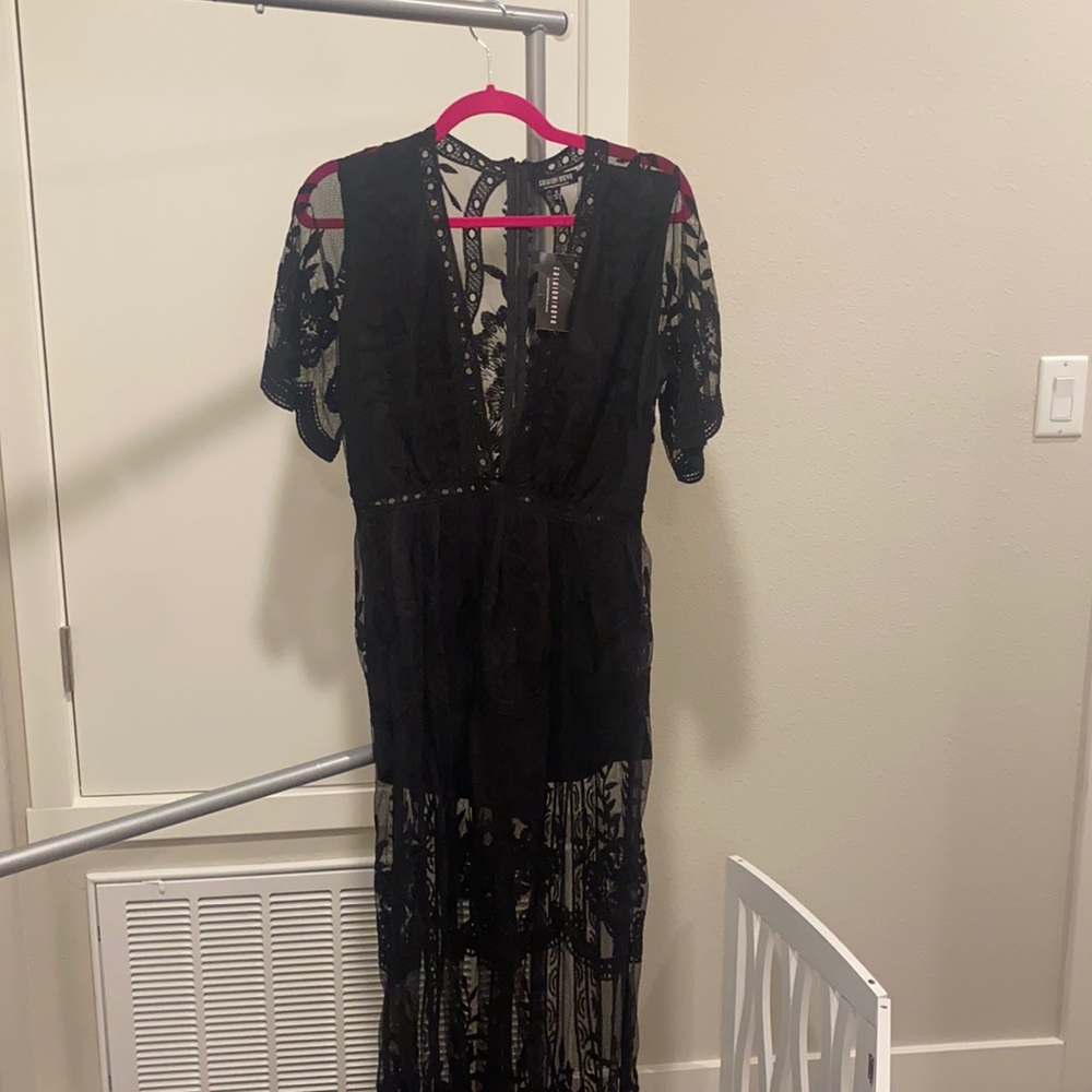 A black lace/mesh type dress